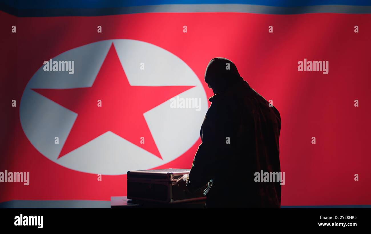 North Korean air defense operator uses radar detecting missile attacks, conducting space surveillance and satellite tracking. Pyongyang regime agent uses military software preventing rockets, camera B Stock Photo