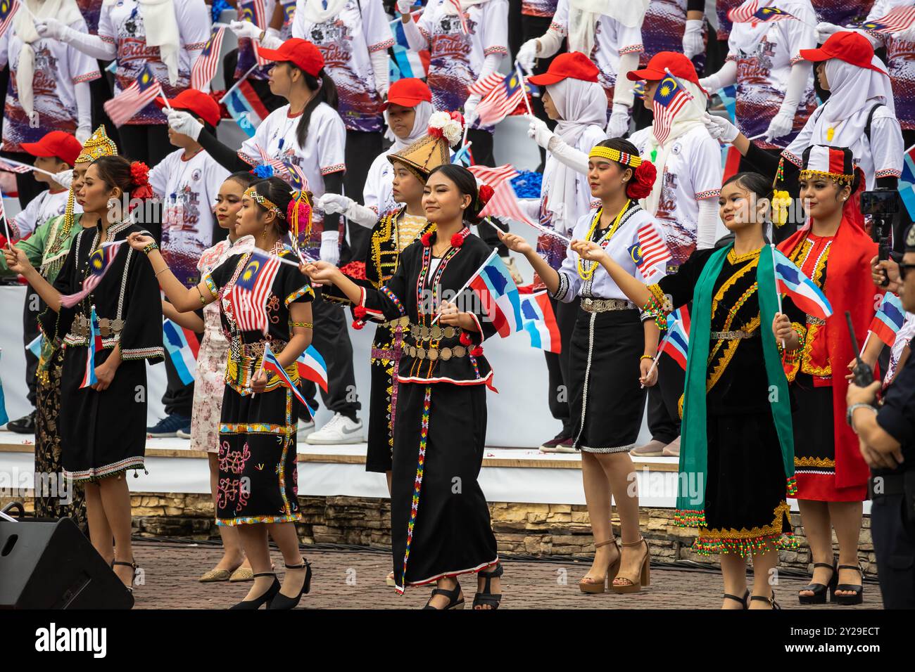 Unity in Diversity. Young women dress in traditional costume of native ...