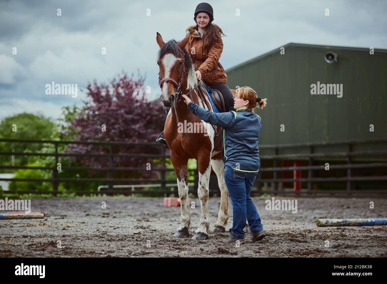 Sw Riding Trainer Horse, child and trainer on farm for riding sport, countryside training ...