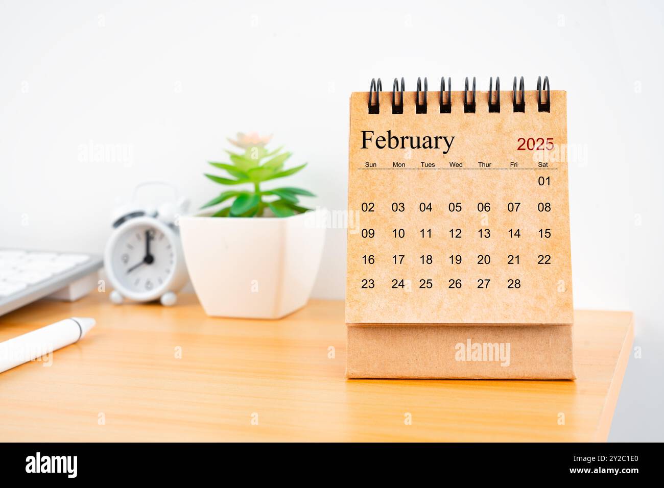 Front view of February 2025 desk calendar on worktable Stock Photo - Alamy