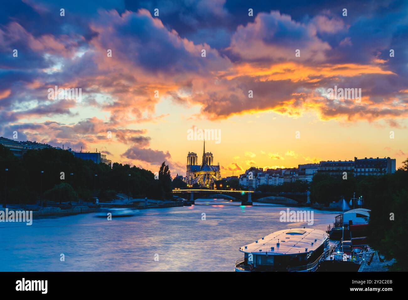 Night scene of Notre Dame de Paris Cathedral and Seine River in Paris, France Stock Photo