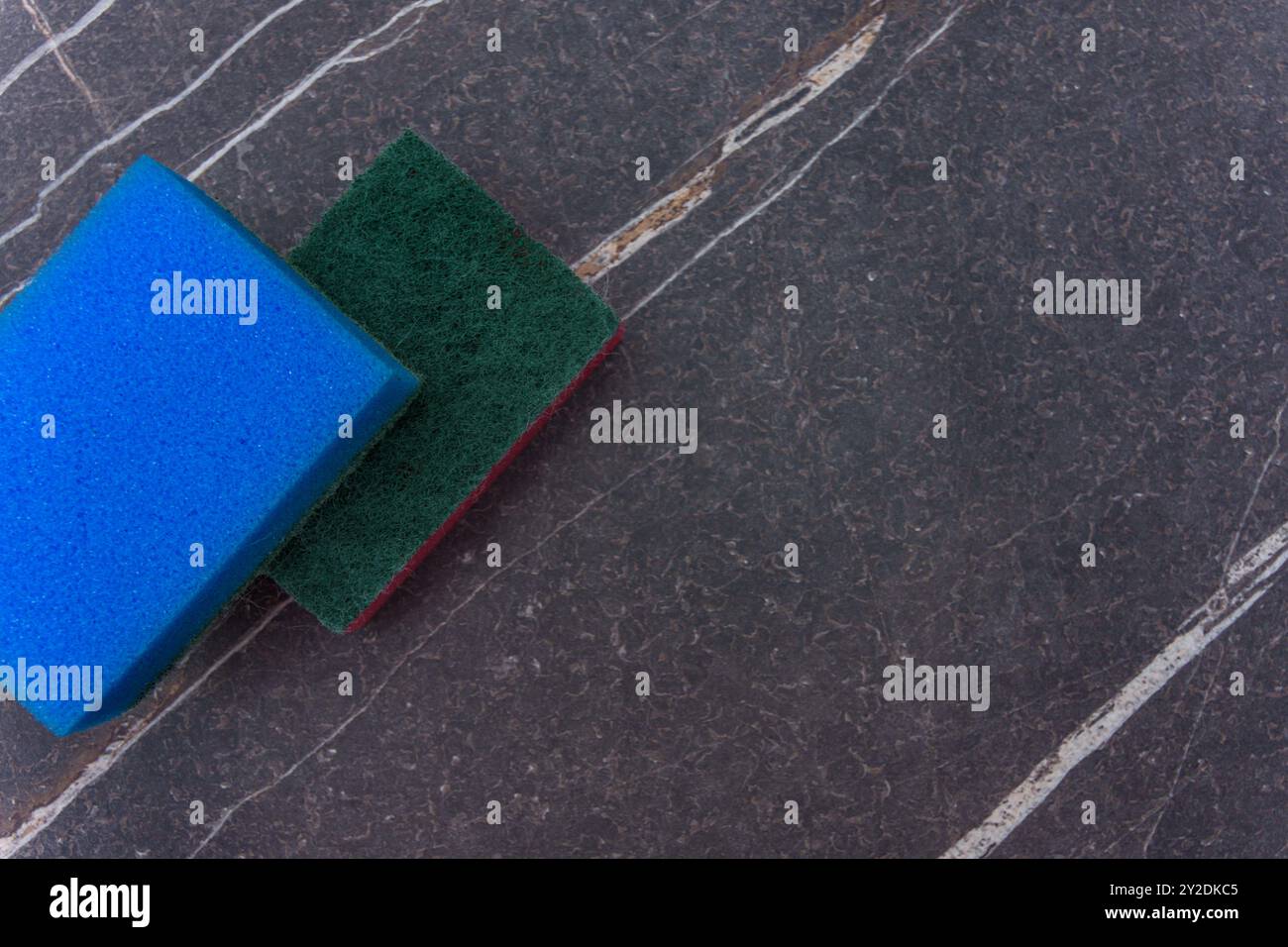 Two cleaning sponges on a marble background Stock Photo