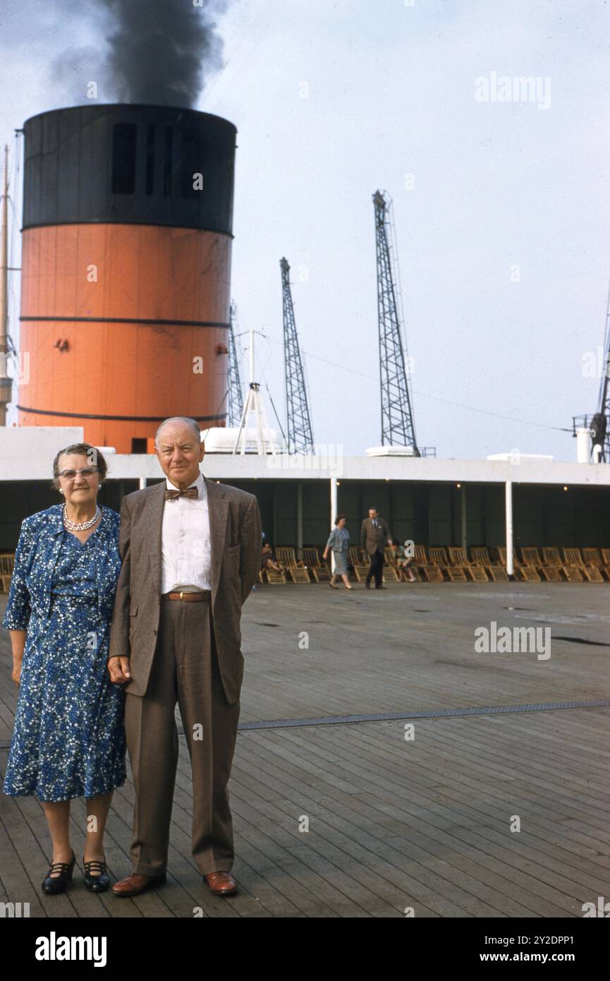 Passengers aboard the Queen Elizabeth Liner with funnel in background in 1962   Photo by The Henshaw Archive Stock Photo