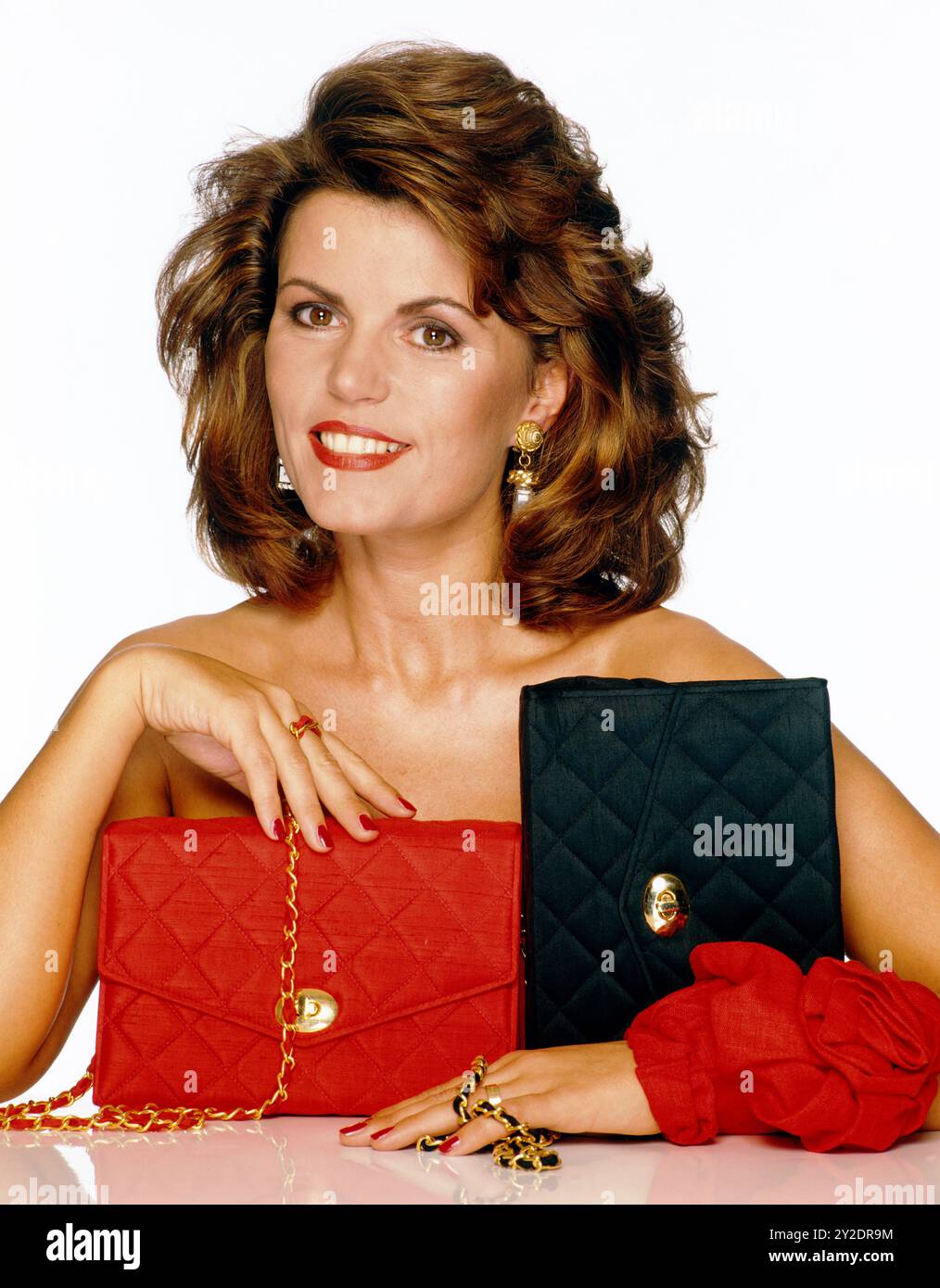 CAROL NEEDHAM, WITH RED/ BLACK BAGS Stock Photo