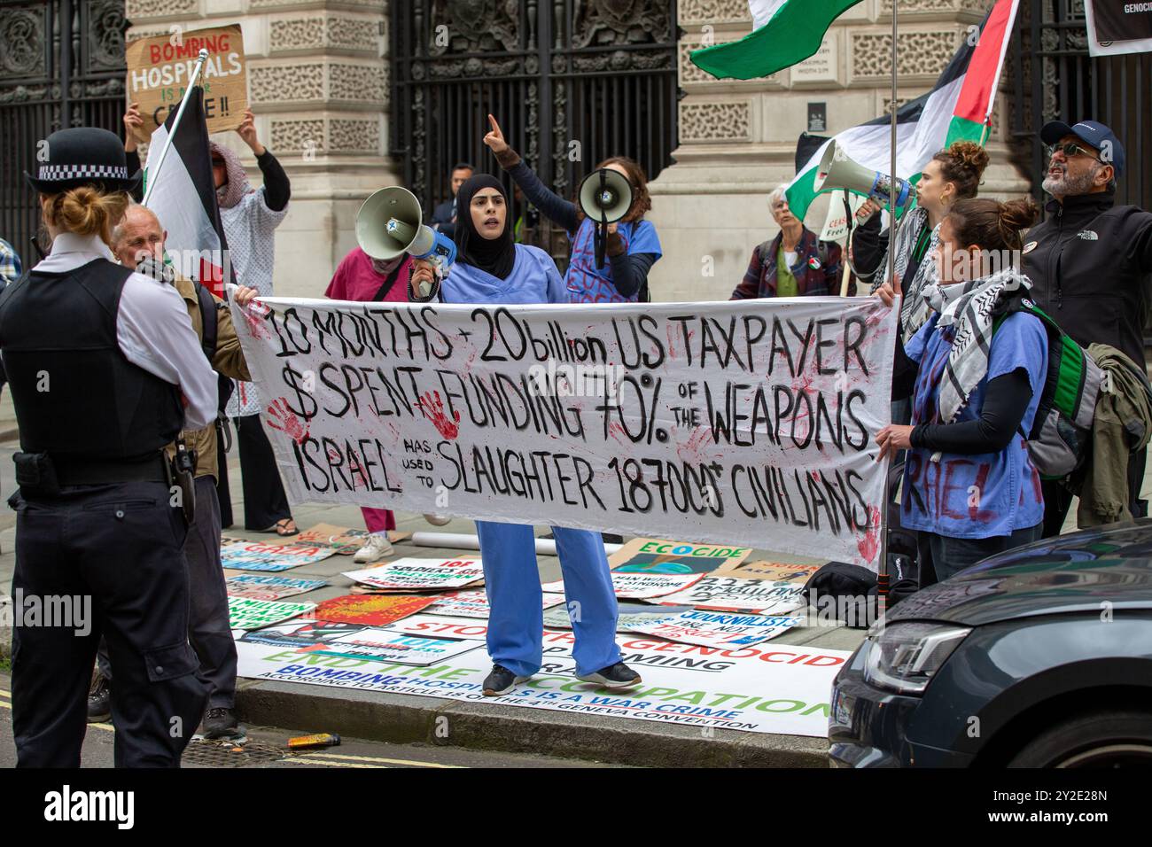 London, England, UK. 10th Sep, 2024. protesters hold placard stating that the 'UK government is funding Israel's war on healthcare'. Pro-Palestine protesters gathered outside the Foreign, Commonwealth and Development Office in Westminster demanding an arms embargo on Israel as the war in Gaza continues Credit: Richard Lincoln/Alamy Live News Stock Photo