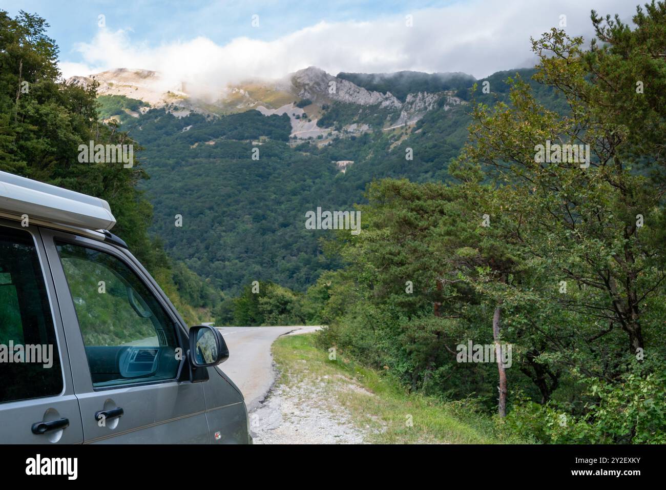 Camper van on a winding road in the pre Alps mountain range of Vercors ...