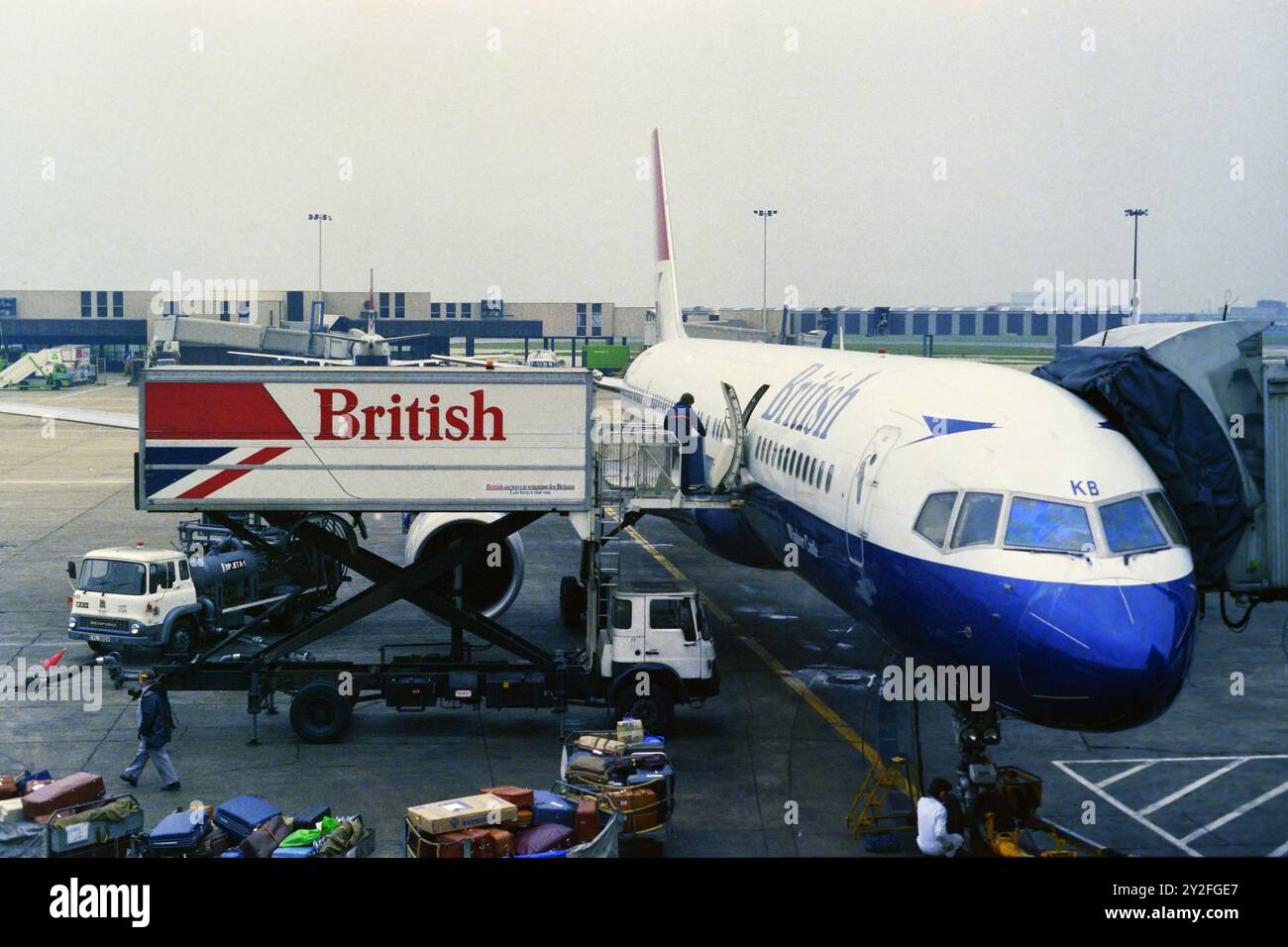 Old 1980's 35mm negative film scan. Boeing 737-236, G-BGDE, of British Airways at  Luton ? airport in the 1980's. Stock Photo