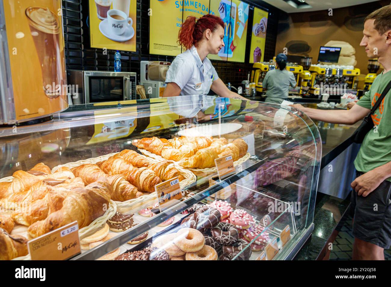 Rome Italy,Piazza di Spagna,Spanish square plaza,McDonald's fast food,hamburger restaurant,inside interior,McCafe counter,croissants doughnuts donuts, Stock Photo