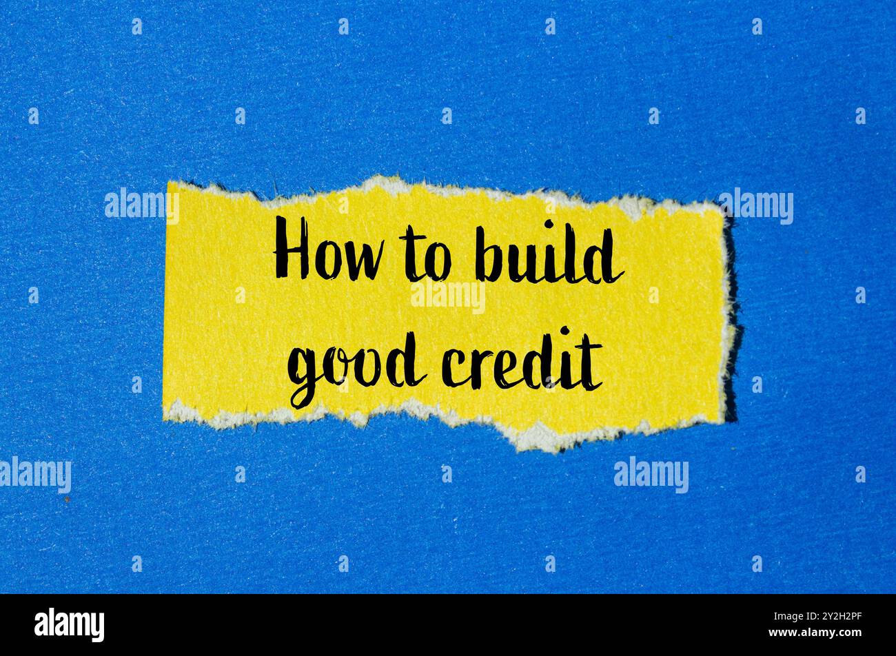 How to build good credit message written on ripped yellow torn paper ...