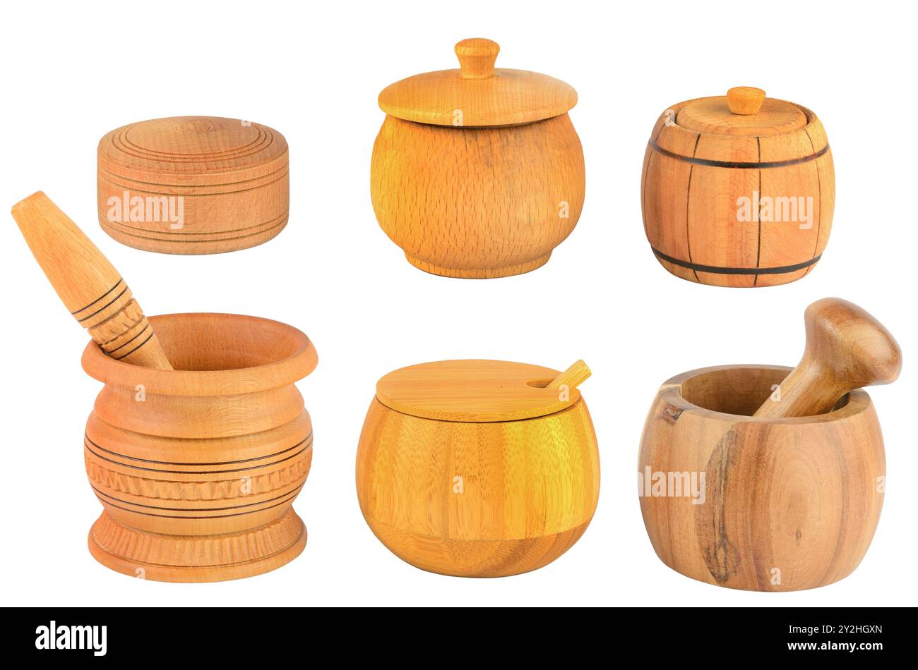 Wooden pestle, mortar and spice boxes isolated on white background. Stock Photo