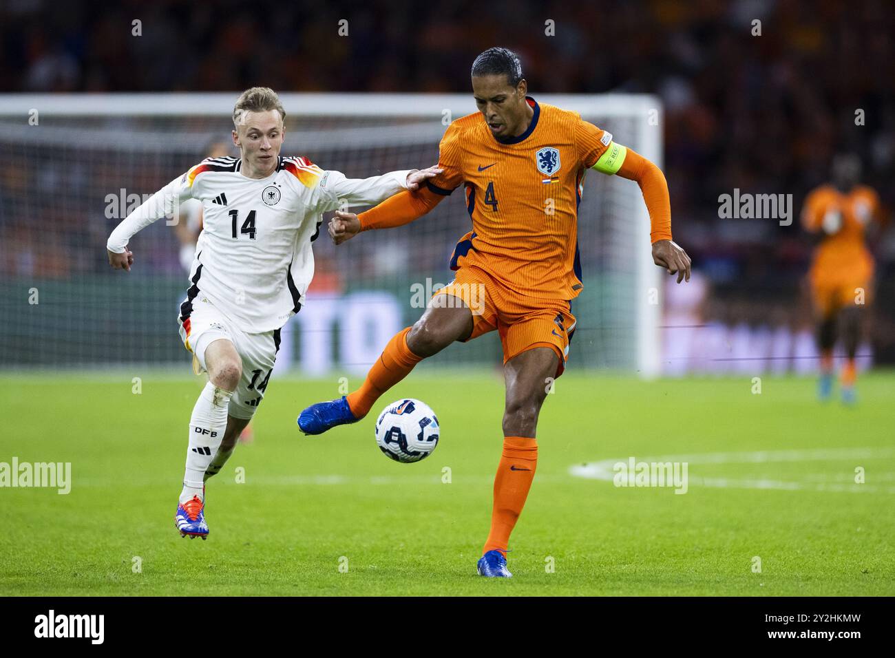 AMSTERDAM - (l-r) Maximilian Beier of Germany, Virgil van Dijk of Holland during the UEFA Nations League match between the Netherlands and Germany at the Johan Cruyff ArenA on Sept. 10, 2024 in Amsterdam, Netherlands. ANP ROBIN VAN LONKHUIJSEN Stock Photo