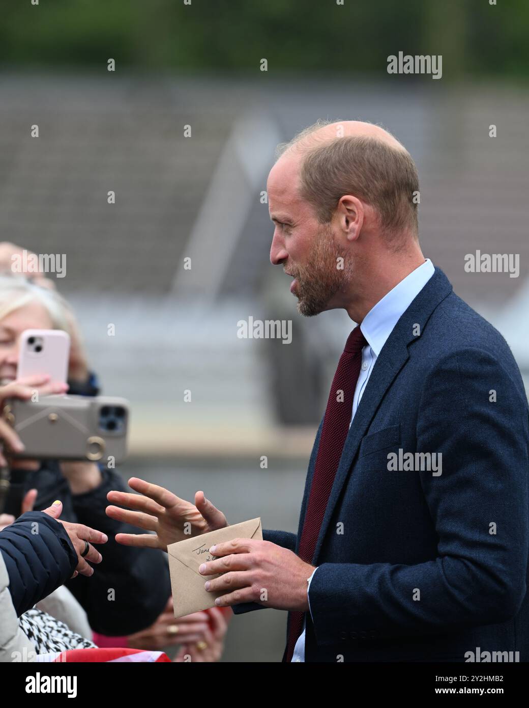 Llanelli, Wales UK 10th Sep 2024 HRH Prince William, Prince of Wales greets well-wishers outside Swiss Valley Primary School where he met students who took part in the 2024 Urdd Eisteddfod; a week-long festival celebrating the Welsh language and culture. His trip to Llanelli, South Wales also included a visit to the Wales Air Ambulance of which he is patron, and Parc y Scarlets, the home of the Scarlets Rugby Union team. Stock Photo