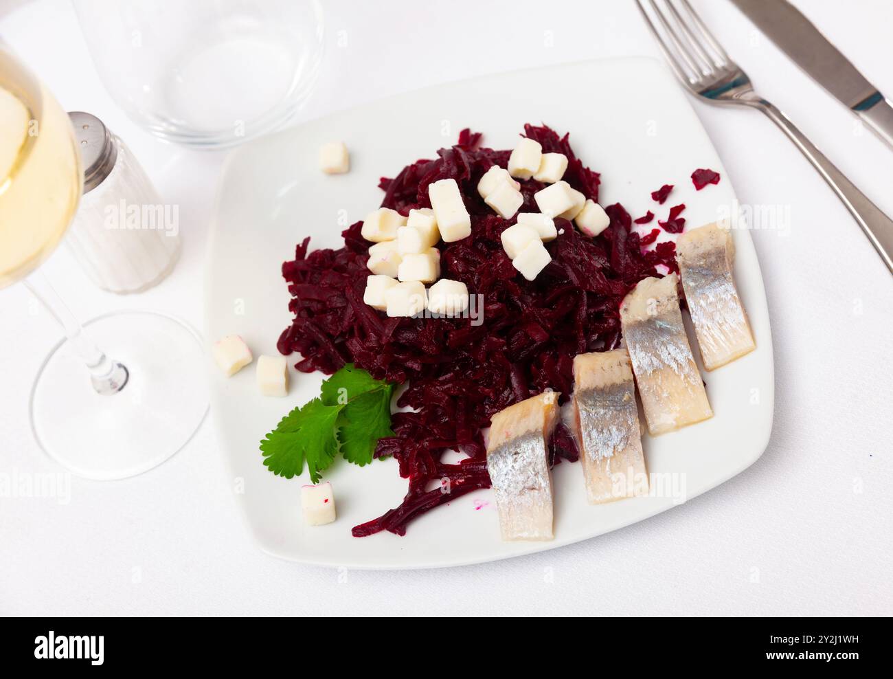 Beetroot served with cheese and pickled mackerel Stock Photo