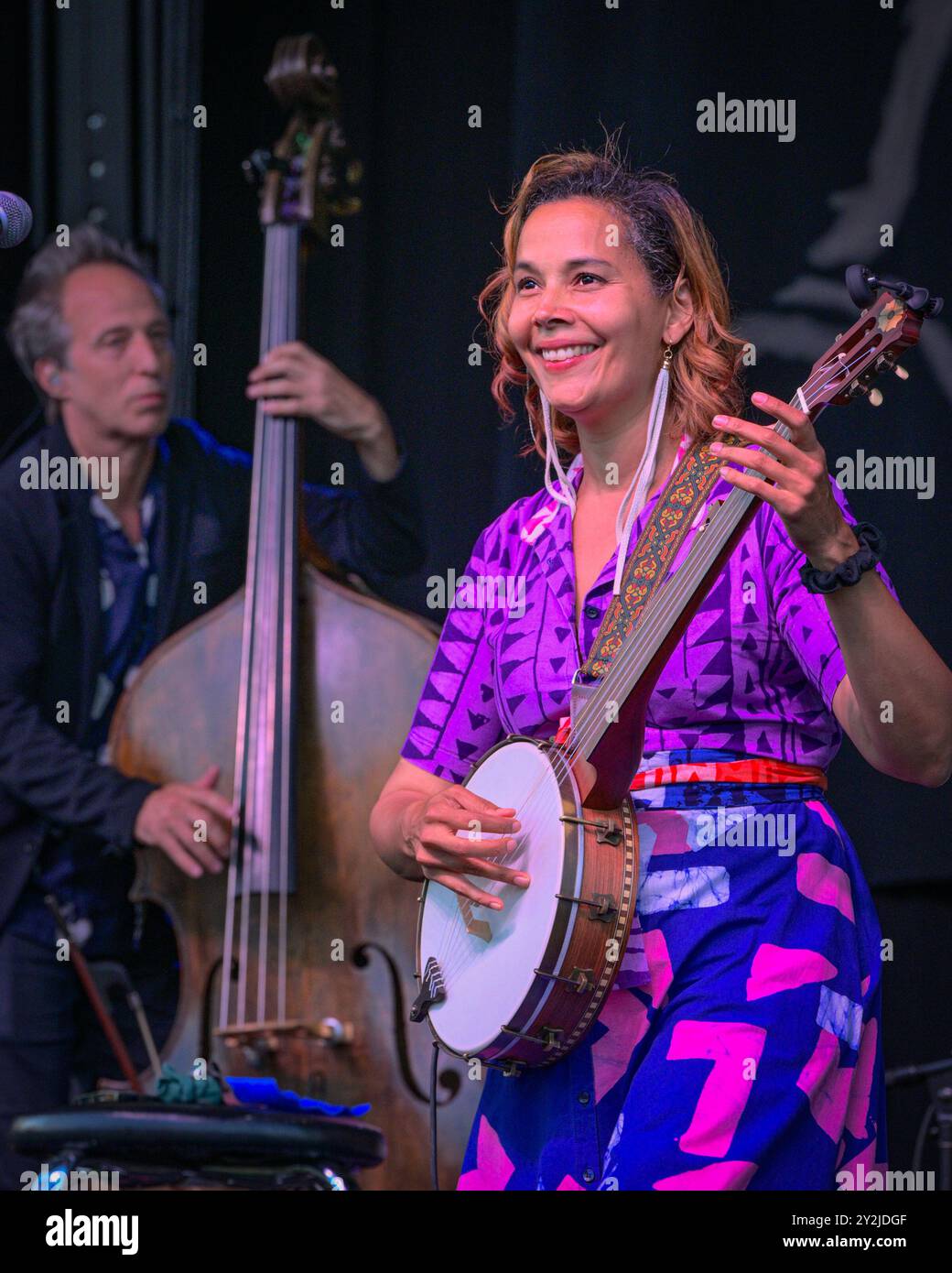 Rhiannon Giddens playing banjo  in concert Stock Photo