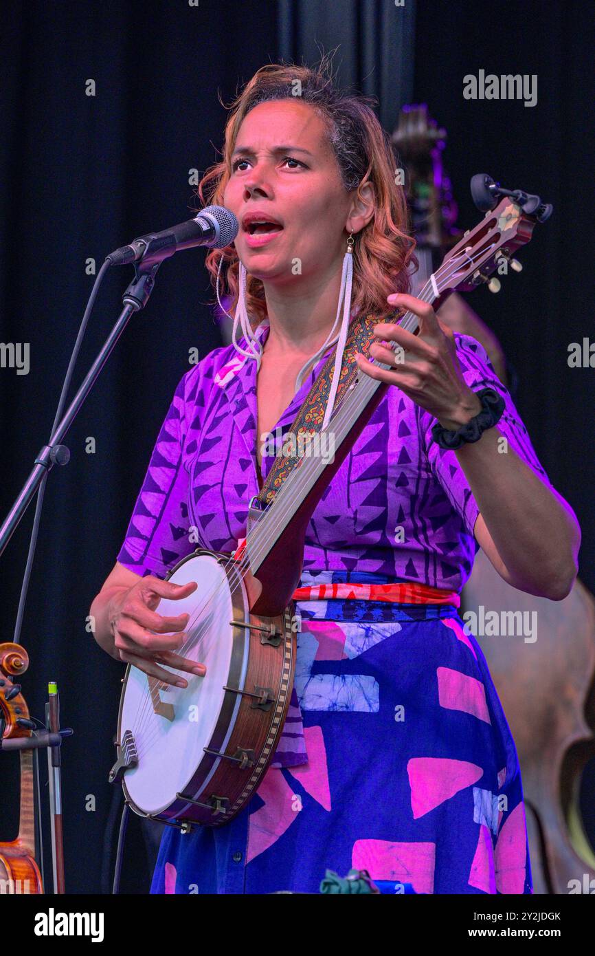 Rhiannon Giddens playing banjo  in concert Stock Photo