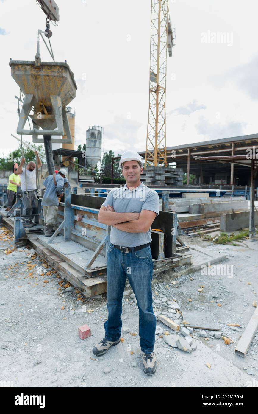 full length portrait of male worker construction site Stock Photo - Alamy