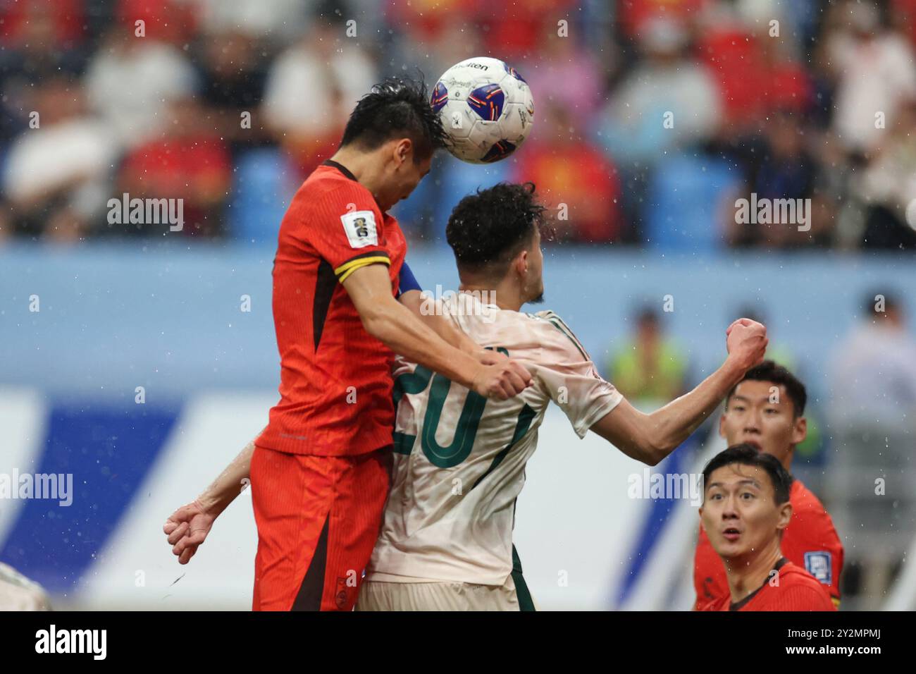 Chinese player Wu Lei (left) heads the ball during the game. Dalian,China.10th September 2024.The second round of Group C in the round of 18 of the 2026 Asian World Cup qualifiers, the Chinese team lost 1-2 to the Saudi Arabia team at home in Dalian, Liaoning Province, on September 10, 2024.Credit: Fu Tian/China News Service/Alamy Live News Stock Photo