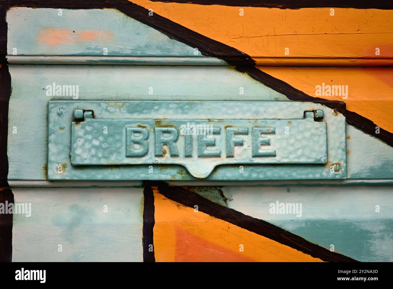 Old colorful letterbox at a door in germany. Stock Photo