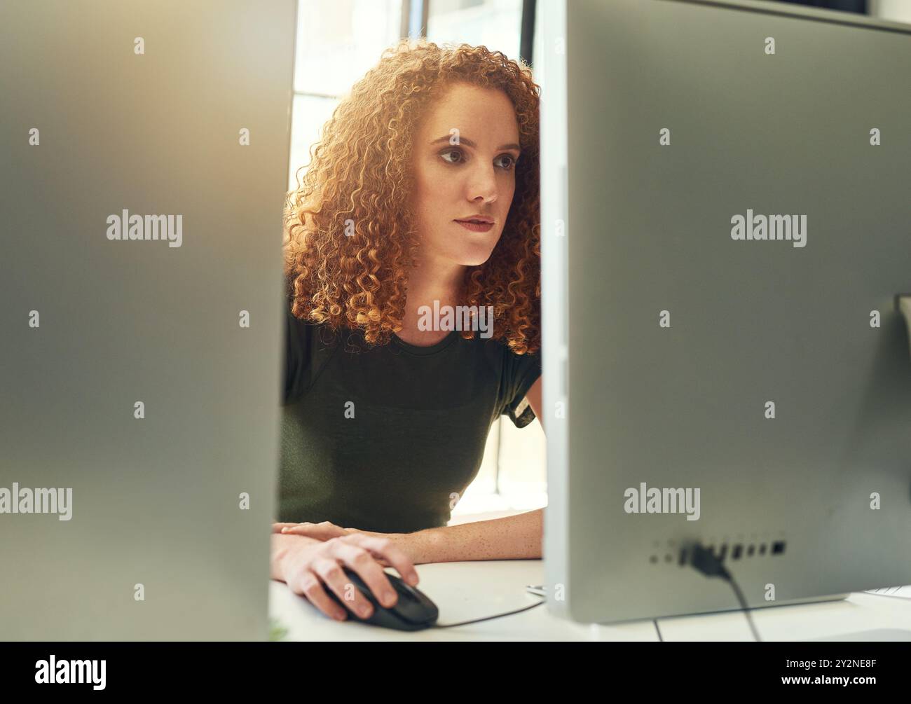 Computer, reading and woman in office with research for information technology with cloud computing. Desktop, database and female software developer Stock Photo
