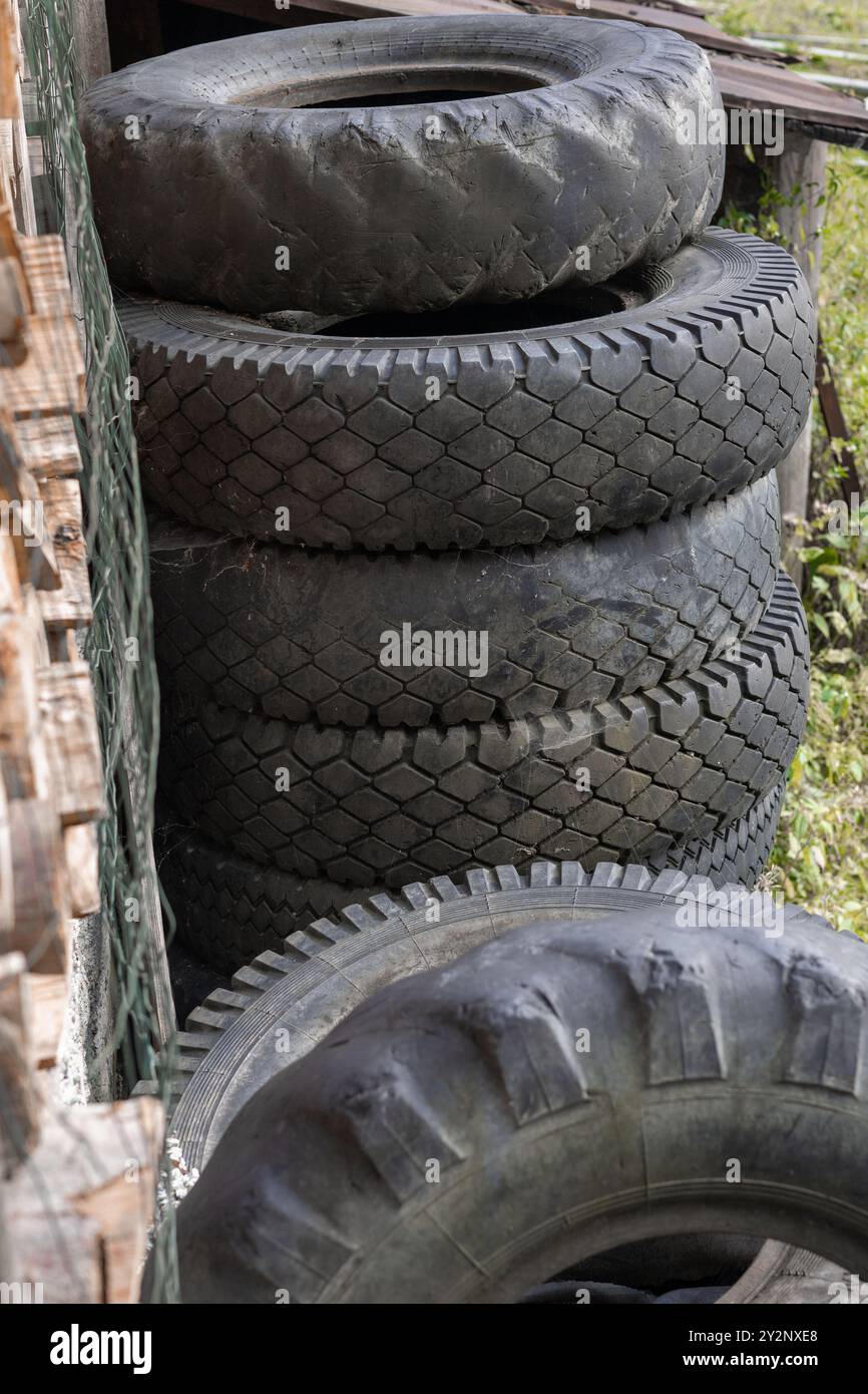 tractor and car balck old tires in a stack Stock Photo