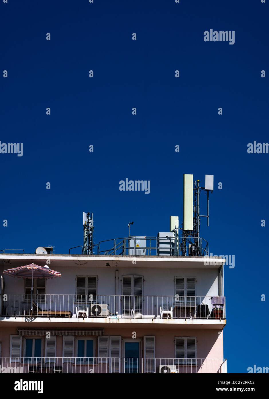 Cellphone mast on apartment building near Bastia, Corsica Stock Photo