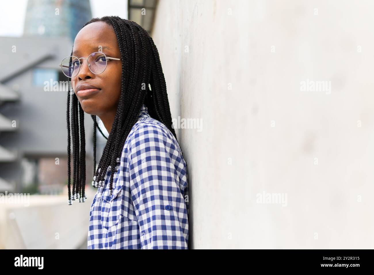 Woman wearing glasses braids hi-res stock photography and images - Alamy