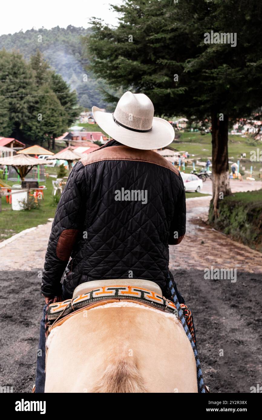 Back view of an unrecognizable rider in La Marquesa, Toluca, Mexico ...
