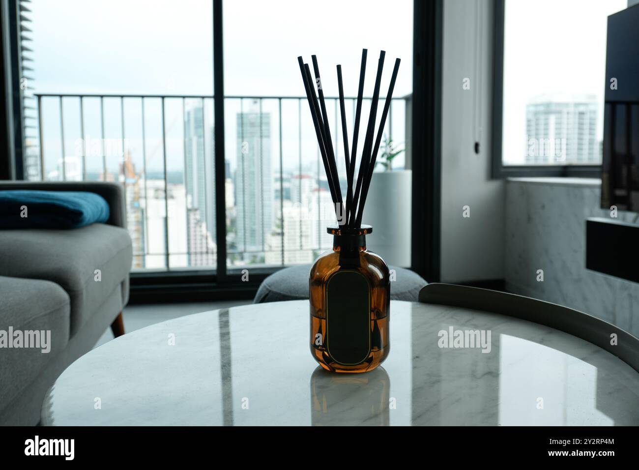 Oil diffuser on a marble table with an empty label Stock Photo