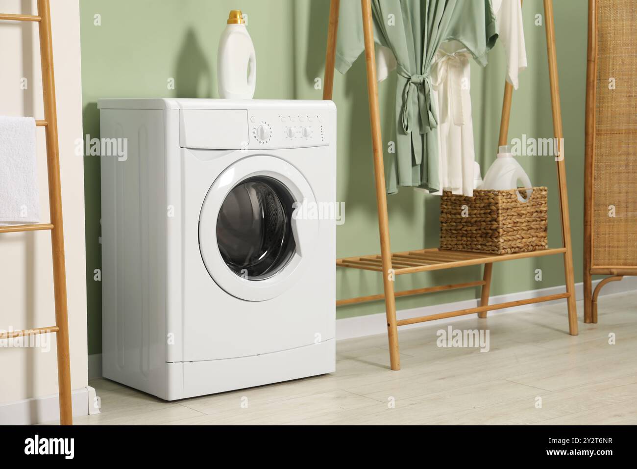 Washing machine and detergent in laundry room Stock Photo - Alamy