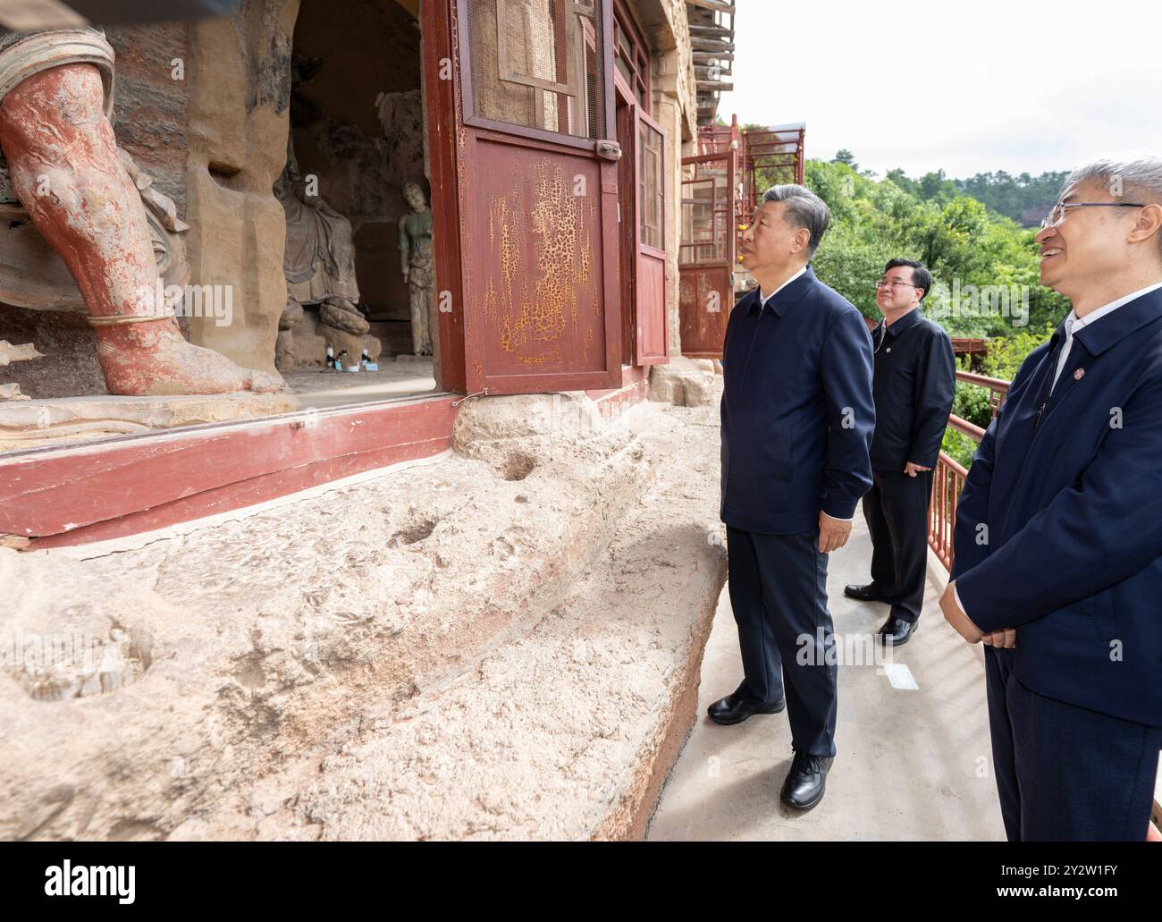 Tianshui, China's Gansu Province. 11th Sep, 2024. Chinese President Xi Jinping, also general secretary of the Communist Party of China Central Committee and chairman of the Central Military Commission, visits the Maijishan Grottoes to learn about the protection and preservation of local cultural heritage in Tianshui, northwest China's Gansu Province, Sept. 11, 2024. Xi inspected the city of Baoji in northwest China's Shaanxi Province and the city of Tianshui in neighboring Gansu Province from Tuesday afternoon to Wednesday morning. Credit: Xie Huanchi/Xinhua/Alamy Live News Stock Photo