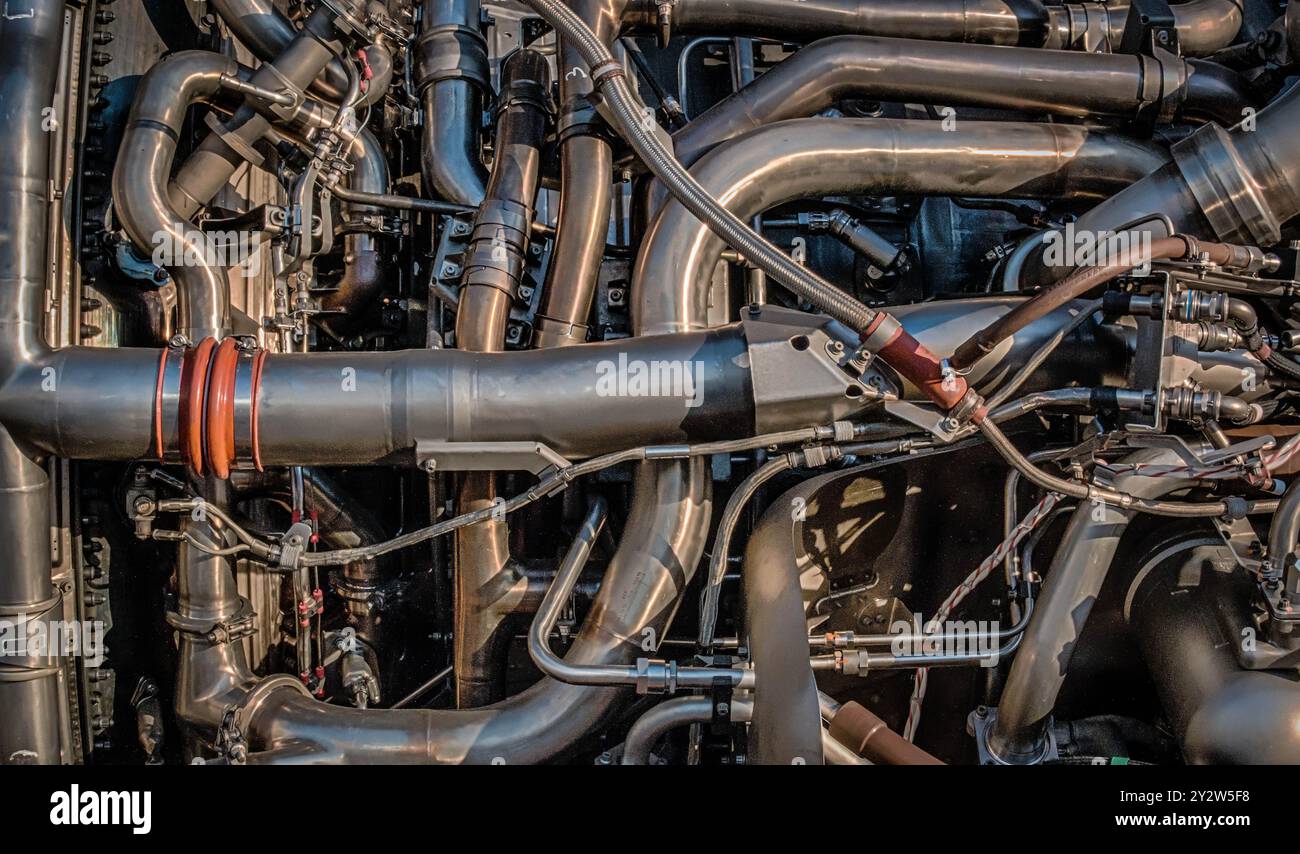 A close-up of a complex network of pipes in an engine Stock Photo - Alamy