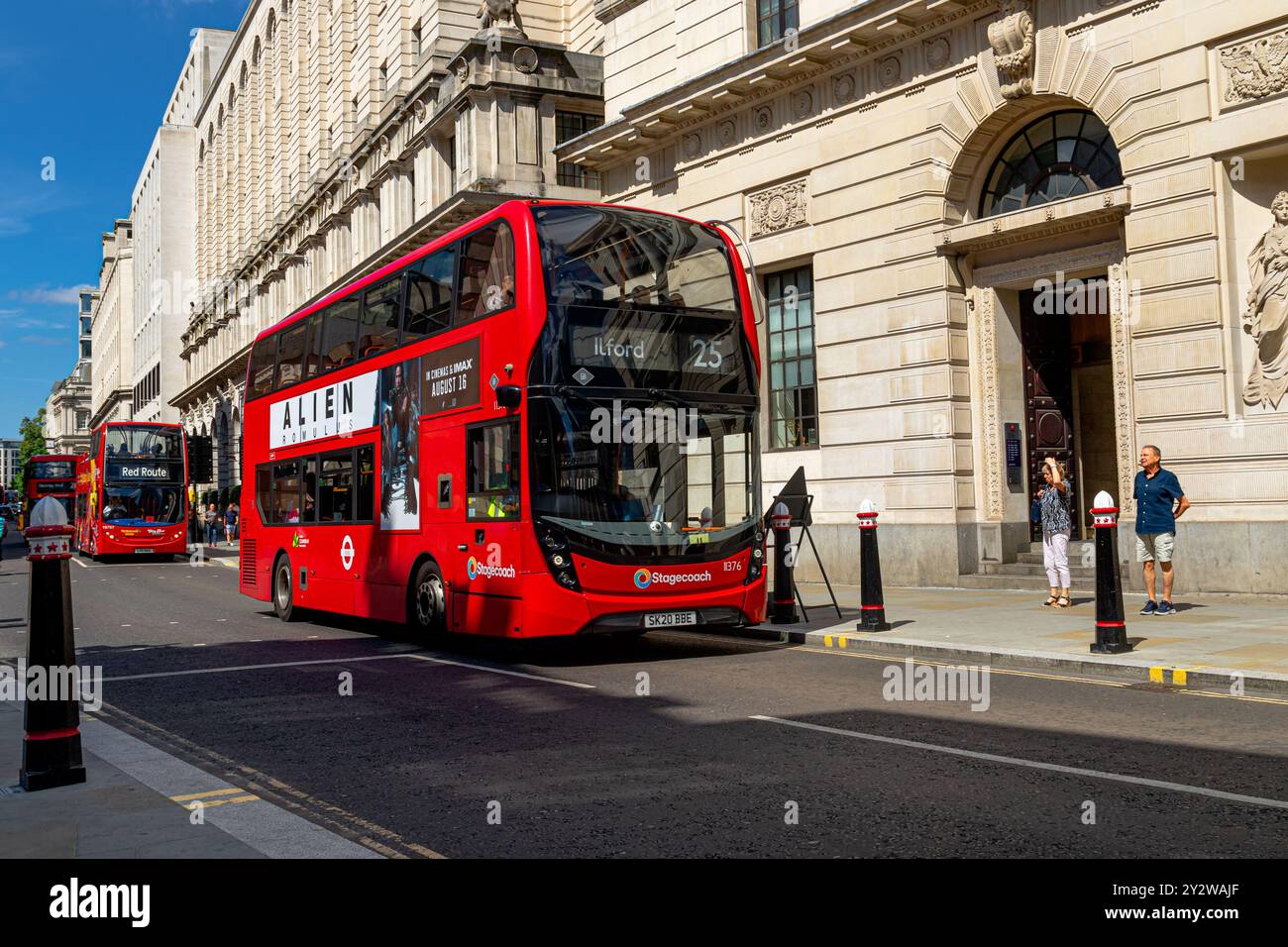 A No 25 red London double decker bus makes it's way along Poultry in The City Of London ,London, UK Stock Photo