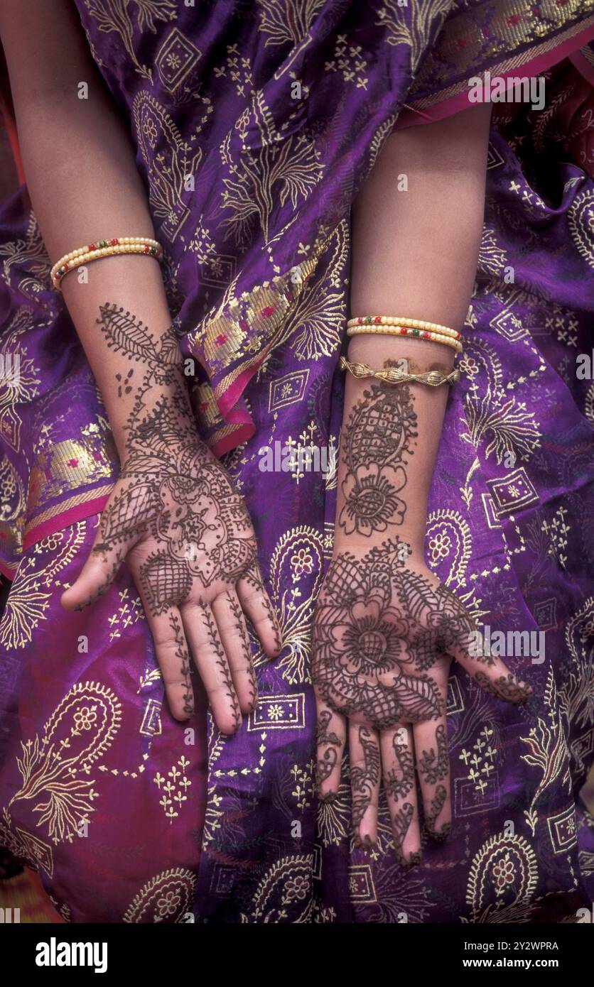 a Rajasthani women is making a Henna Hand painting in the Town of ...