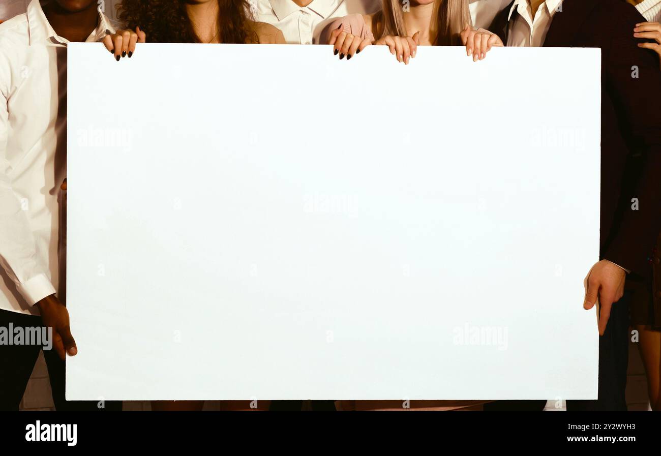 Unrecognizable Young People Holding Blank White Poster Standing Indoor ...