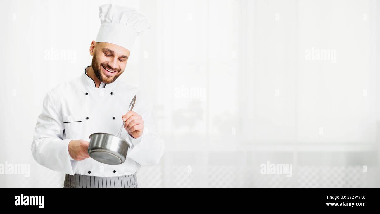 Male chef mixing ingredients with whisk in the kitchen Stock Photo - Alamy