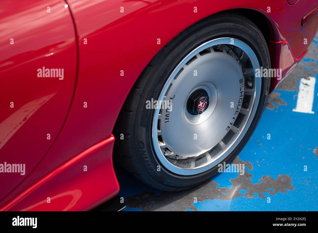 Detail of the impressive single-nut Impul Silhouette competition wheels of the third generation Mazda Rx-7, an icon of Japanese tuning culture Stock Photo