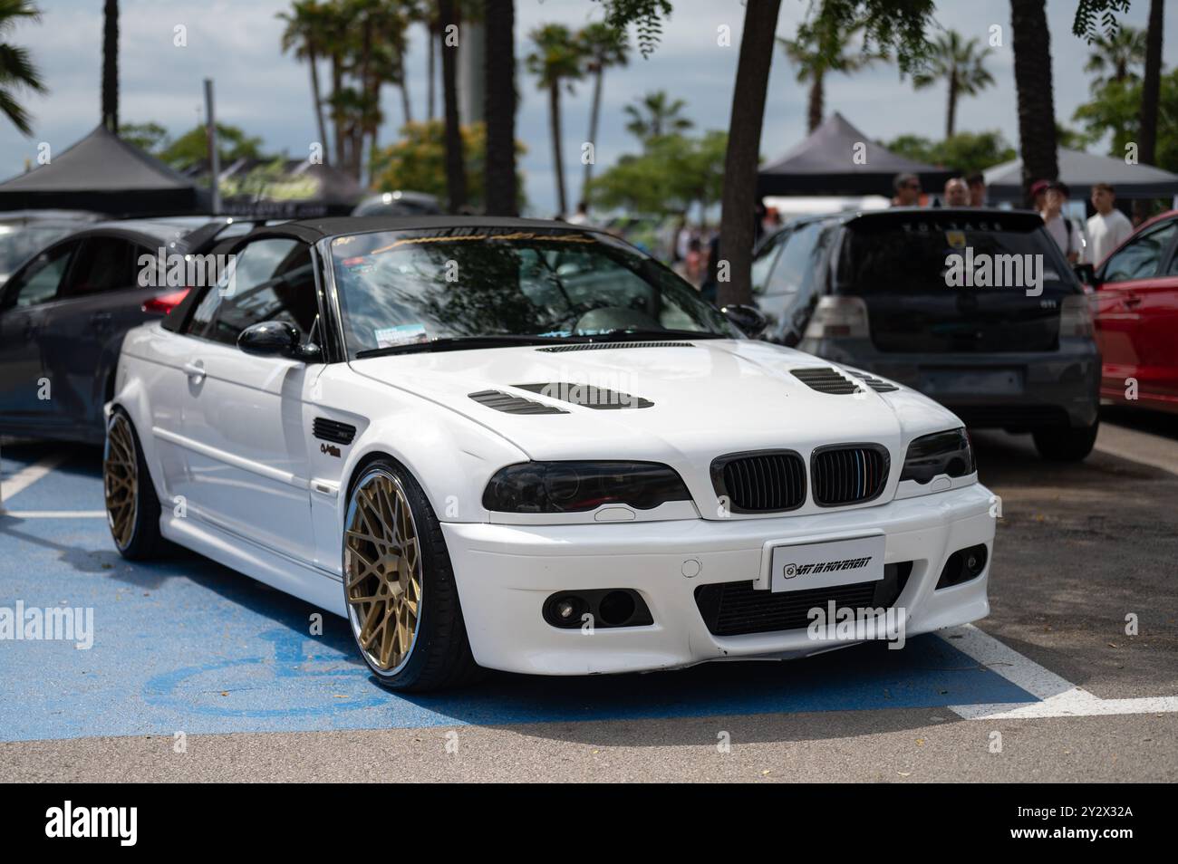 white BMW E46 convertible with retractable canvas roof with large gold wheels and smoked headlights. It is enhanced and tuned with great taste Stock Photo Alamy