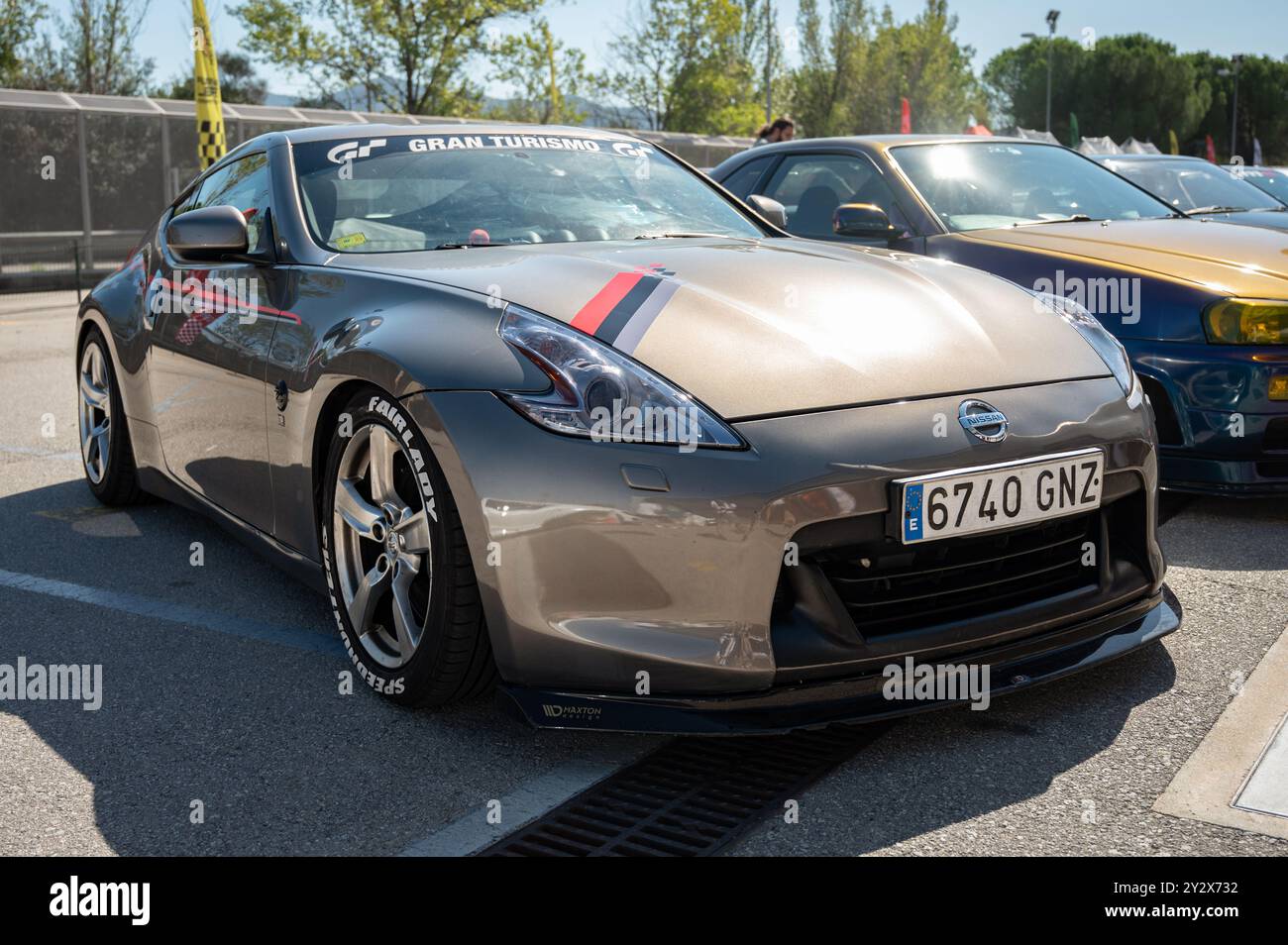 Front view of a nice gray-brown Japanese sports car Nissan