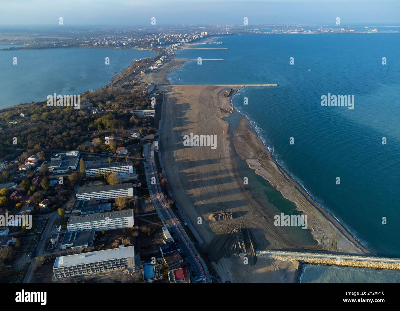 Aerial view of a coastal city with sandy beaches, blue ocean, and ...