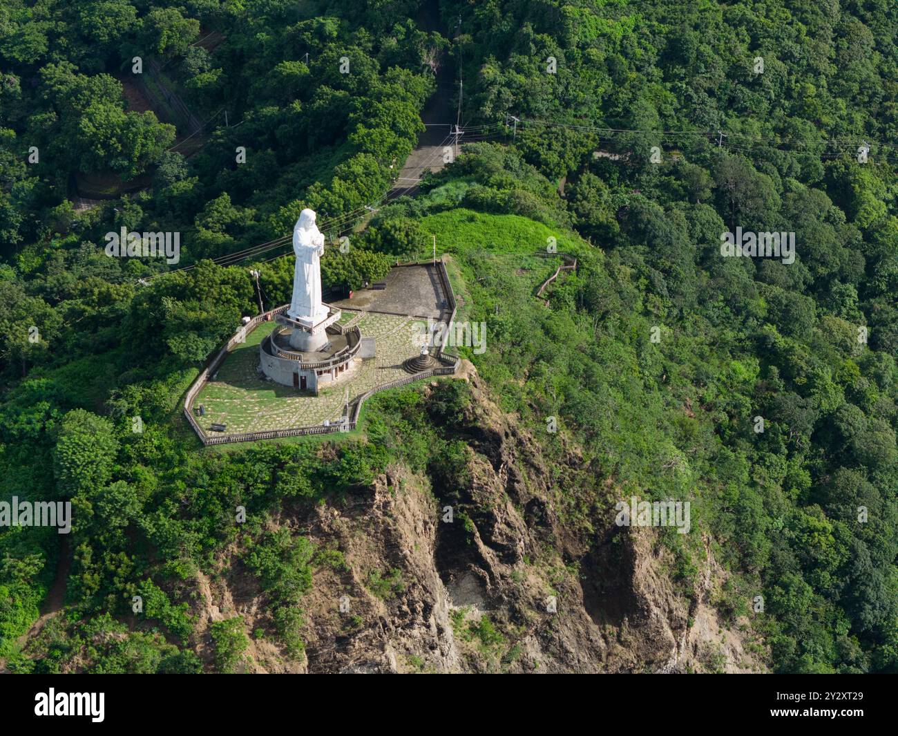 White christ statue on green hill in San Juan Del Sur Nicaragua aerial view Stock Photo