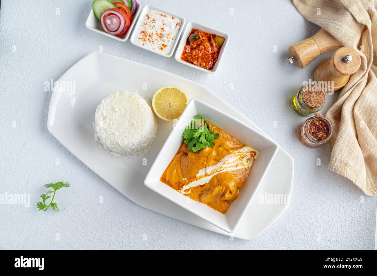 A top view of a delicious chicken tikka masala on a white plate Stock Photo