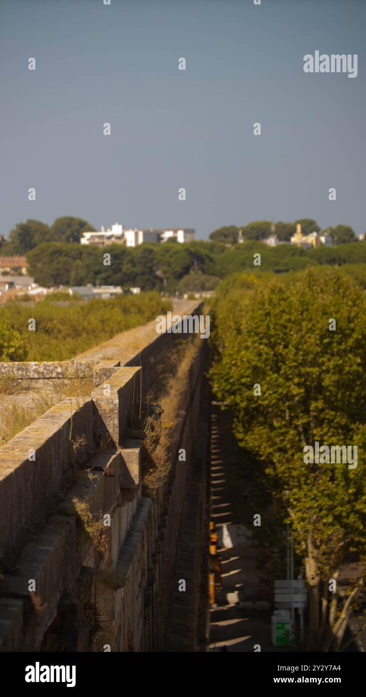 A long ancient stone aqueduct stretching into the distance Stock Photo ...
