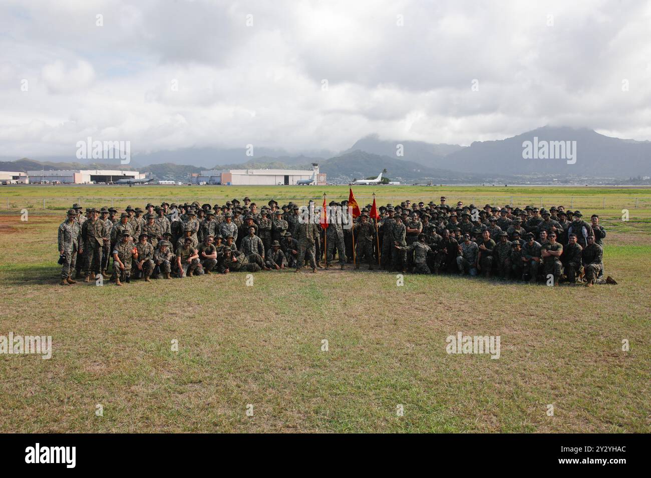 U.S. Marines with Marine Corps Air Station Kaneohe Bay pose for a photo during a warrior’s night, Marine Corps Base Hawaii, Aug. 29, 2024. The warrior’s night consisted of pugil stick fighting, grappling, and tug-of-war, followed by an award ceremony, and a mess night to uphold Marine Corps traditions and boost unit camaraderie. (U.S. Marine Corps photo by Lance Cpl. Taylor Von Sanders-Frazer) Stock Photo