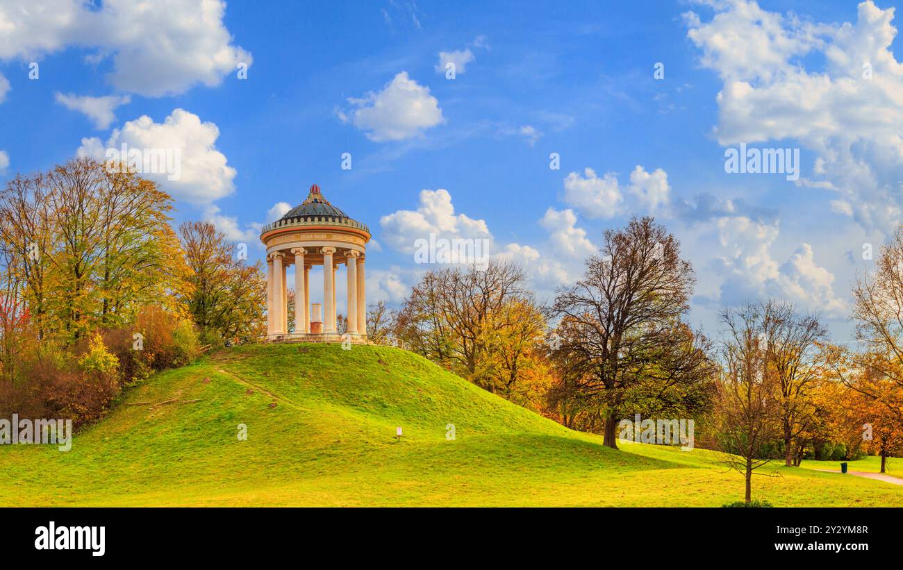 Autumn landscape - view of a monopteros is a circular colonnade on the hill in the Englischer Garten public park in Munich, Bavaria, Germany Stock Photo
