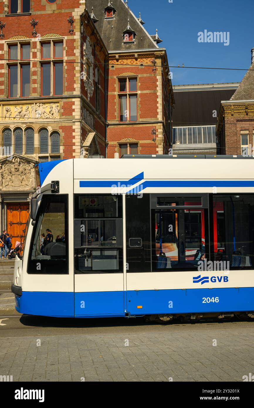 A stationary Dutch tram at Amsterdam Centraal Station on a sunny, summer day, Amsterdam, The Netherlands Stock Photo