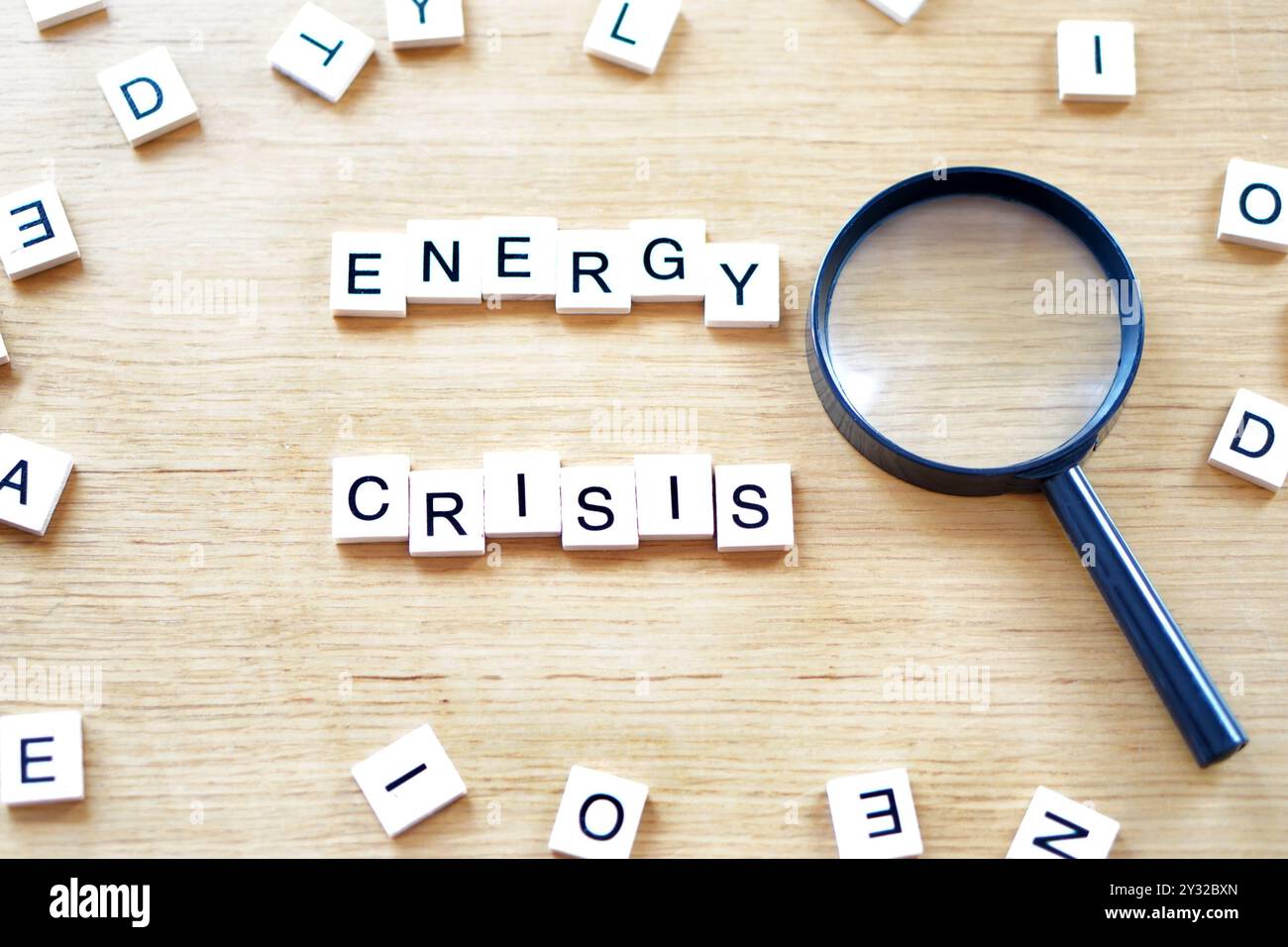 ENERGY CRISIS. wooden letters with magnifying glass Stock Photo - Alamy