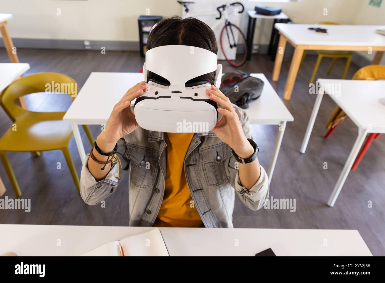 Using VR headset, asian teenage boy exploring virtual reality in school ...