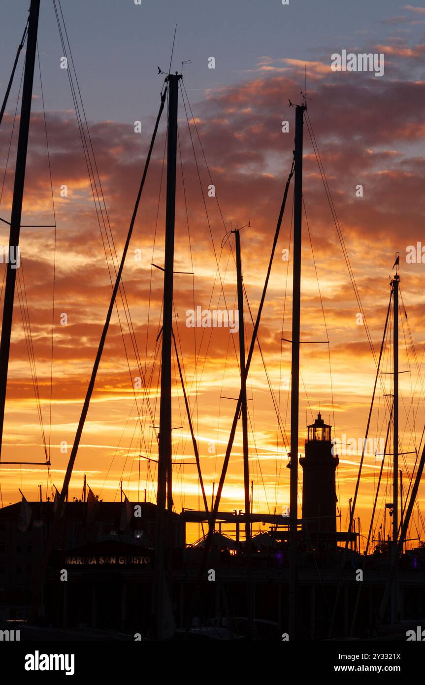 Italy, Friuli Venezia Giulia, Trieste, Marina di San Giusto, Faro la Lanterna, Lantern Lighthouse at Sunset Stock Photo