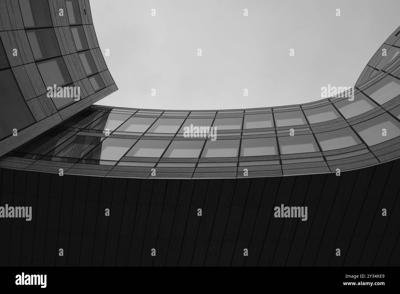 Wave-shaped building in the historic city centre, black and white ...
