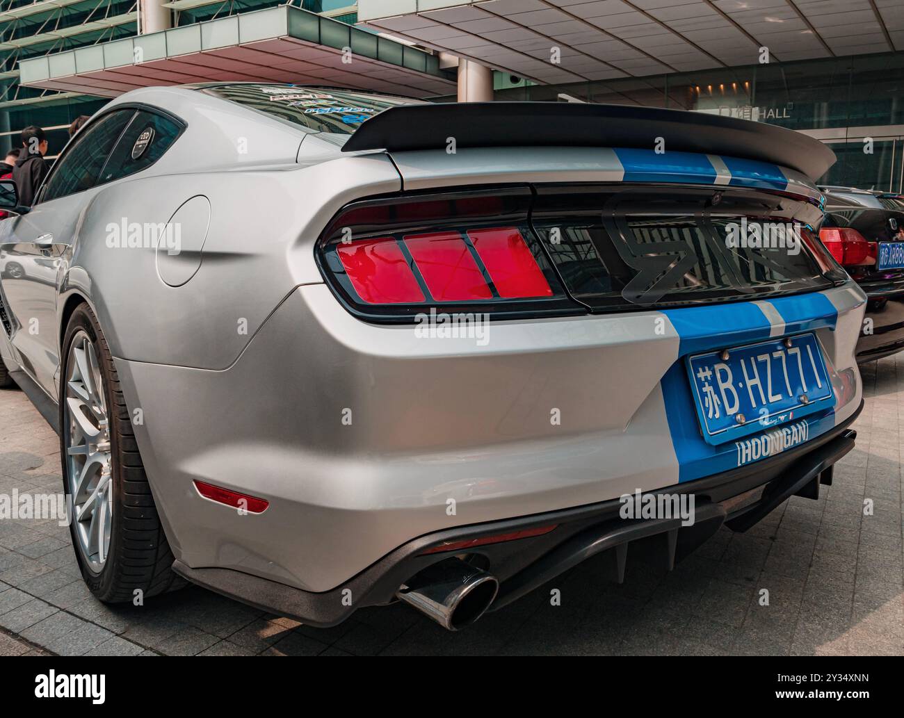 Suzhou, China - March 30, 2019: Teal mustang at a car show with custom exhaust and spoiler Stock Photo